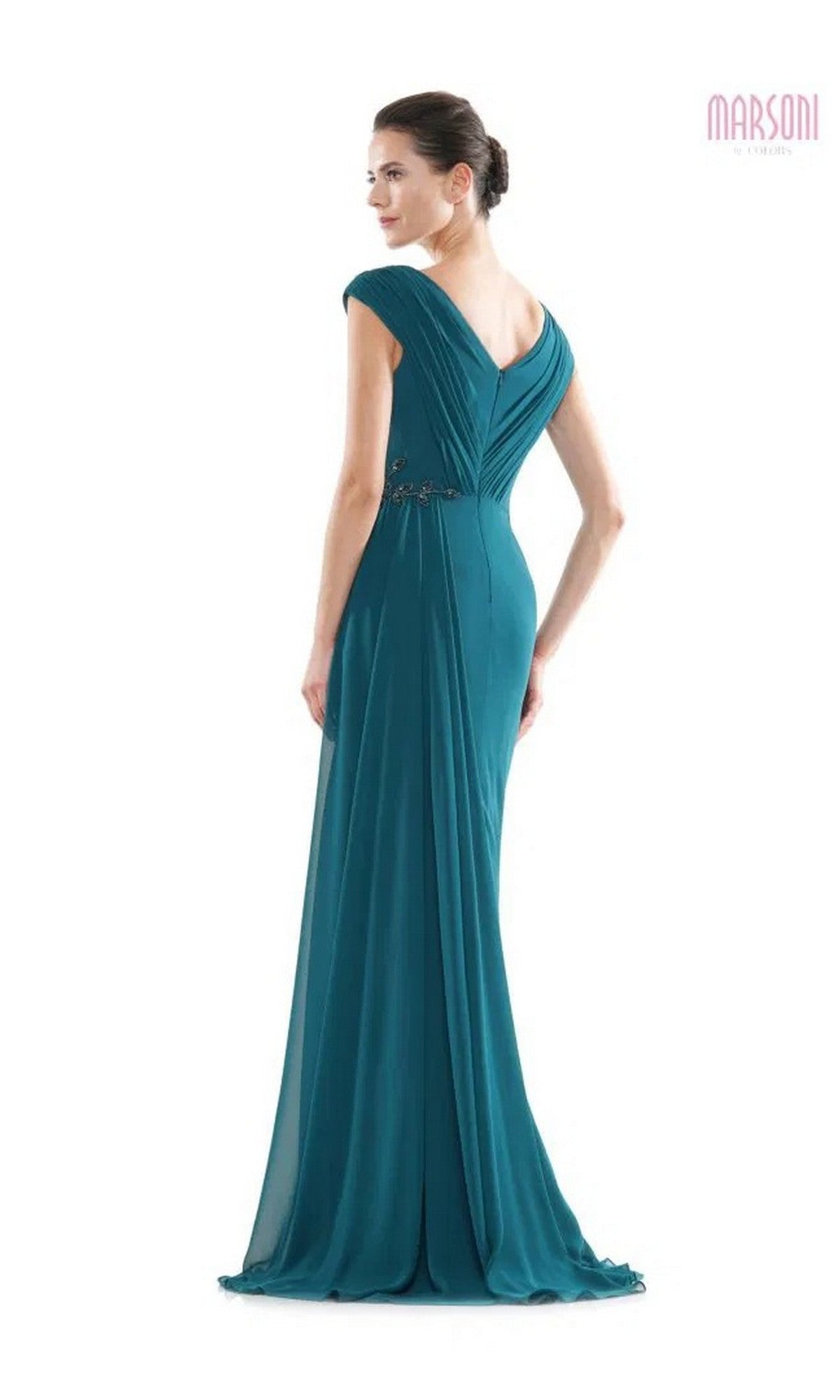 A woman models the Marsoni MV1080, a teal floor-length chiffon formal dress with cap sleeves, V-back, and delicate beaded applique, standing against a white background.